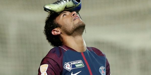Soccer Football - Coupe de la Ligue Quarter Final - Amiens SC vs Paris St Germain - Stade de la Licorne, Amiens, France - January 10, 2018   Paris Saint-Germains Neymar celebrates scoring their first goal from the penalty spot with his football boot on his head   REUTERS/Benoit Tessier     TPX IMAGES OF THE DAY