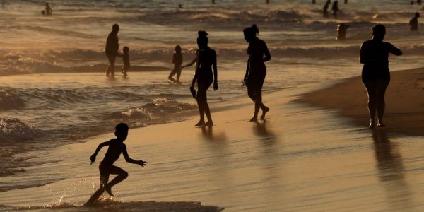 People are seen on Barra da Tijuca beach in Rio de Janeiro, Brazil December 18, 2018. REUTERS/Sergio Moraes