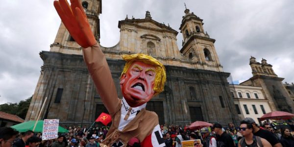 Protesters carry a cutout depicting U.S. President Donald Trump, wearing a Nazi uniform, during a rally commemorating May Day in Bogota, Colombia May 1, 2018. REUTERS/Jaime Saldarriaga