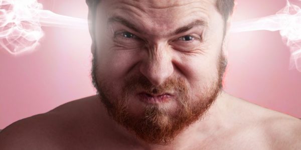 Stress concept - angry frustrated man with exploding head